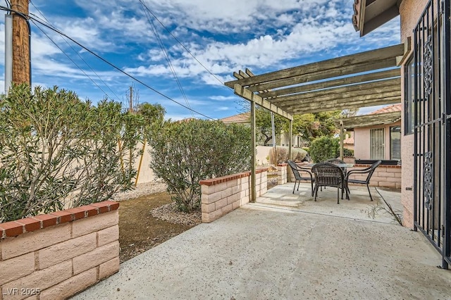 view of patio featuring outdoor dining space, a pergola, and a fenced backyard