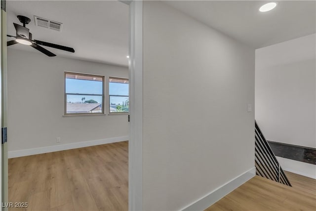 interior space with ceiling fan, visible vents, recessed lighting, wood finished floors, and baseboards