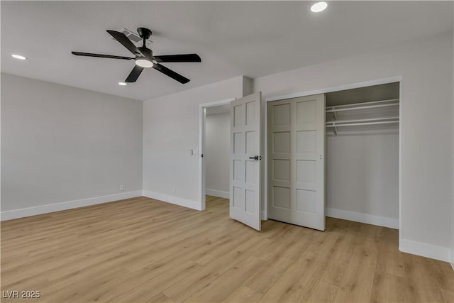 unfurnished bedroom featuring light wood-type flooring, a closet, baseboards, and recessed lighting