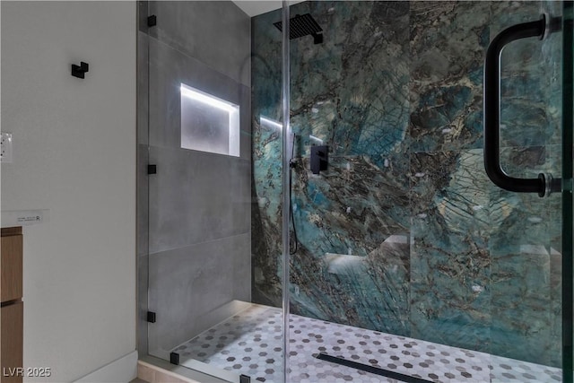 bathroom with a shower stall