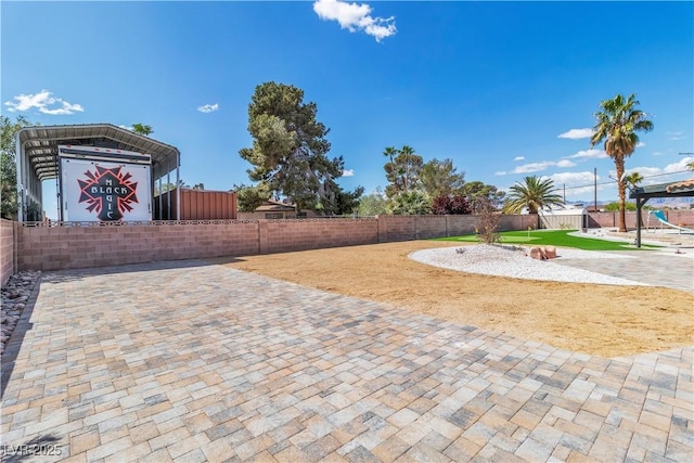view of patio / terrace featuring fence