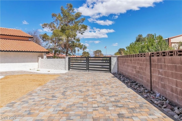 view of gate featuring fence