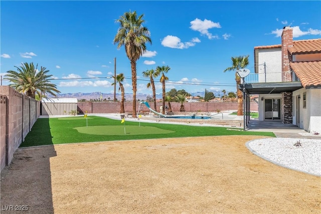 view of yard with a patio and a fenced backyard