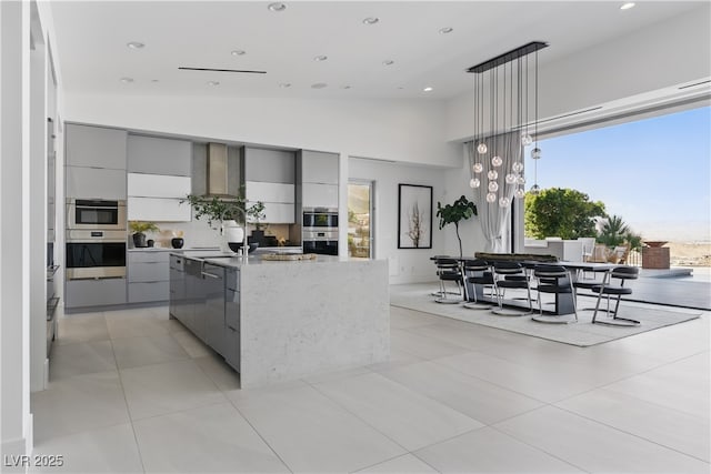 667 Palisade Rim Dr, Henderson, NV 89012 - kitchen with modern cabinets, gray cabinetry, a center island with sink, recessed lighting, and hanging light fixtures