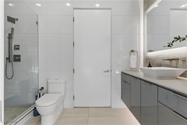 667 Palisade Rim Dr, Henderson, NV 89012 - full bath with vanity, a stall shower, toilet, tile walls, and tile patterned flooring