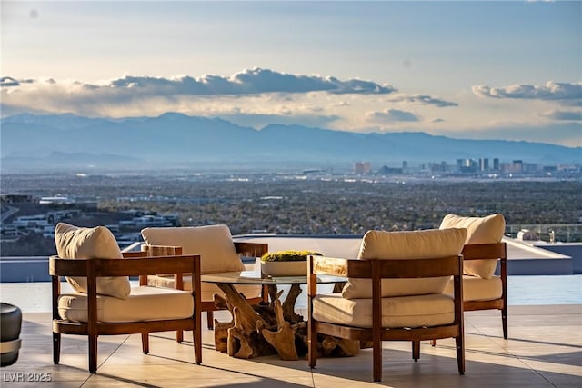 667 Palisade Rim Dr, Henderson, NV 89012 - view of patio with a balcony, a mountain view, and a view of city