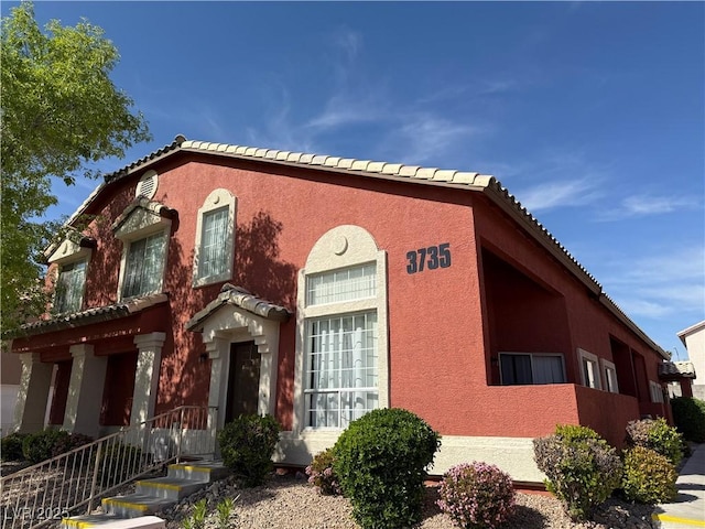 3735 Sand Pier St, Las Vegas, NV 89147 - view of front of property featuring a tile roof and stucco siding