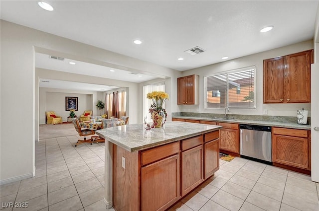 7216 Campolina Ct, Las Vegas, NV 89113 - kitchen featuring stainless steel dishwasher, visible vents, a sink, and light tile patterned flooring