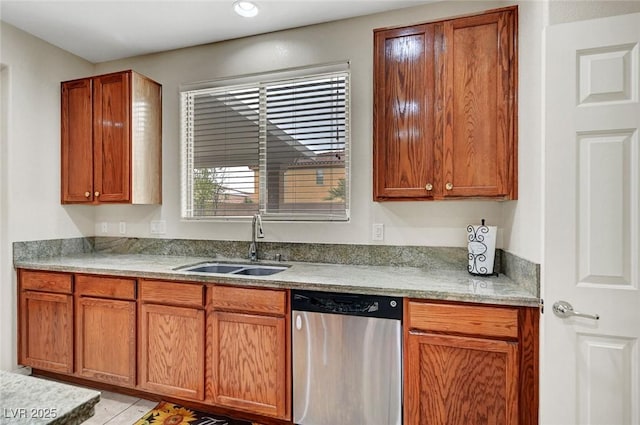 7216 Campolina Ct, Las Vegas, NV 89113 - kitchen featuring brown cabinetry, stainless steel dishwasher, a sink, and light countertops