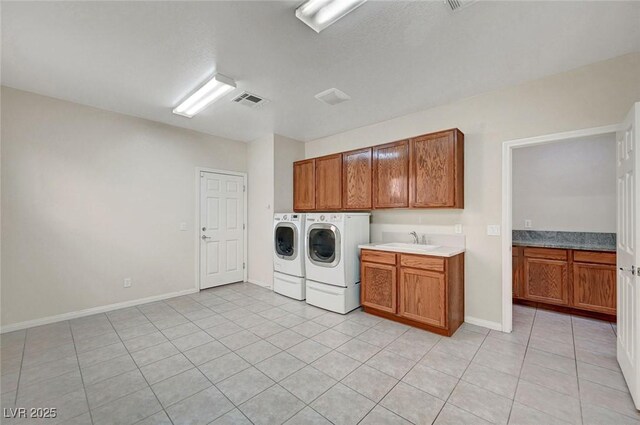 7216 Campolina Ct, Las Vegas, NV 89113 - laundry room featuring a sink, light tile patterned flooring, visible vents, cabinet space, and washer and dryer