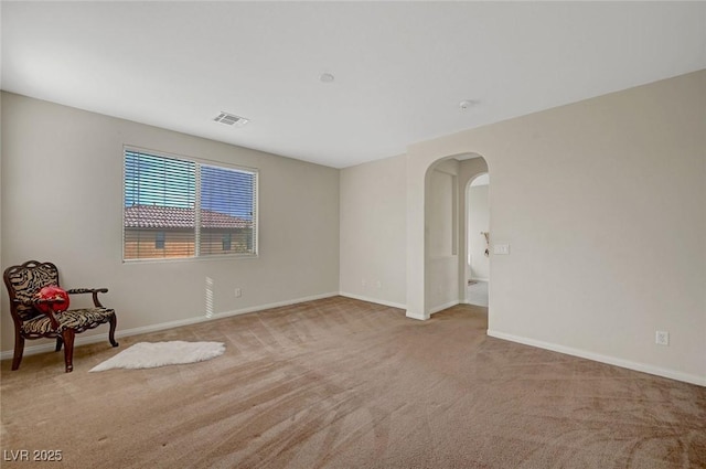 7216 Campolina Ct, Las Vegas, NV 89113 - unfurnished room featuring arched walkways, carpet flooring, visible vents, and baseboards