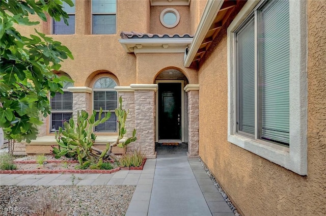 7216 Campolina Ct, Las Vegas, NV 89113 - doorway to property featuring stone siding and stucco siding