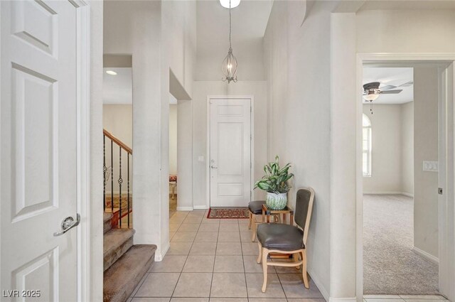 7216 Campolina Ct, Las Vegas, NV 89113 - foyer entrance featuring stairway, ceiling fan, and baseboards