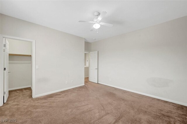 7216 Campolina Ct, Las Vegas, NV 89113 - unfurnished bedroom with carpet, a spacious closet, baseboards, and ceiling fan