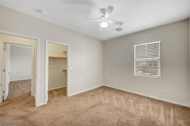 7216 Campolina Ct, Las Vegas, NV 89113 - unfurnished bedroom with baseboards, visible vents, a spacious closet, and light colored carpet