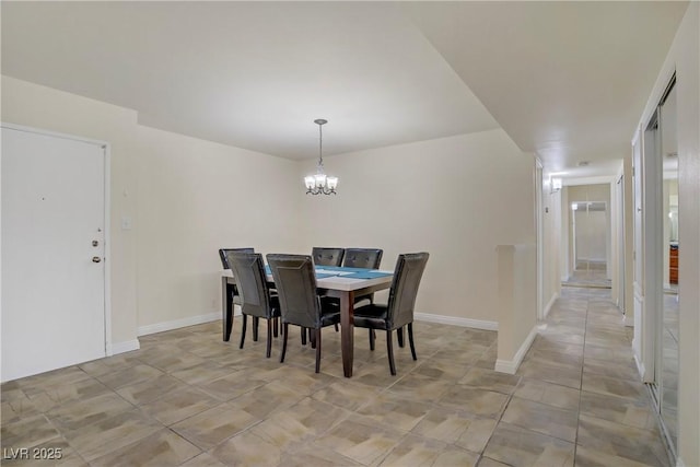 725 N Royal Crest Cir Unit 214, Las Vegas, NV 89169 - dining area featuring a chandelier and baseboards