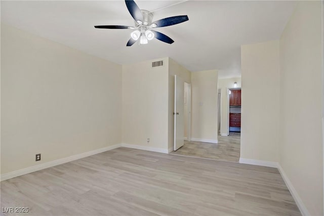 725 N Royal Crest Cir Unit 214, Las Vegas, NV 89169 - spare room featuring light wood-type flooring, ceiling fan, and baseboards