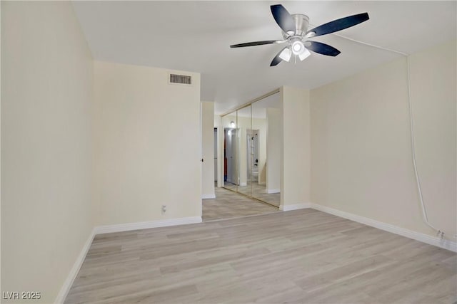 725 N Royal Crest Cir Unit 214, Las Vegas, NV 89169 - empty room featuring light wood-type flooring, a ceiling fan, and baseboards