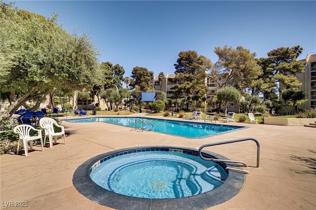 725 N Royal Crest Cir Unit 214, Las Vegas, NV 89169 - community pool featuring a community hot tub and a patio area