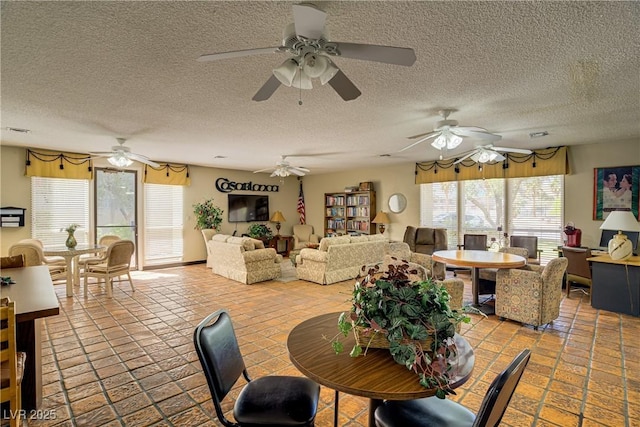 725 N Royal Crest Cir Unit 214, Las Vegas, NV 89169 - dining area featuring a textured ceiling and a ceiling fan
