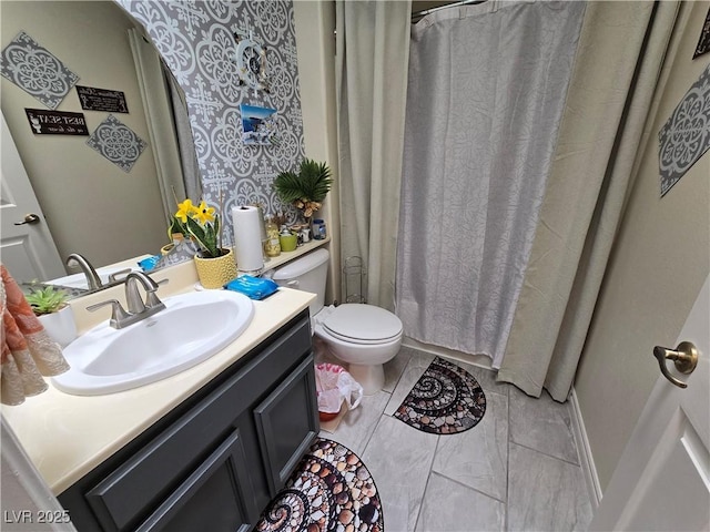 full bath featuring toilet and vanity