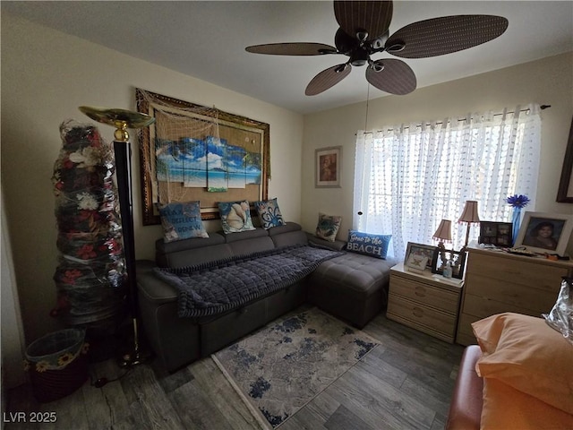 living area with wood finished floors and ceiling fan