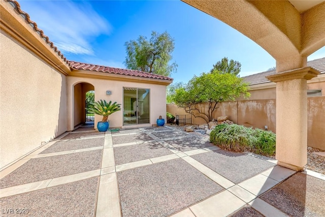 view of patio featuring fence