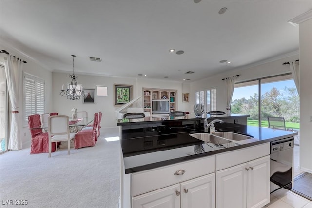 kitchen with dishwasher, a sink, visible vents, and a wealth of natural light