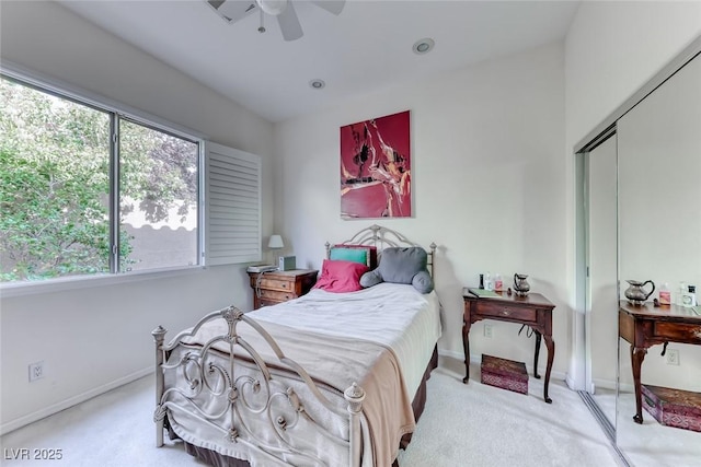 bedroom featuring a closet, baseboards, a ceiling fan, and carpet floors