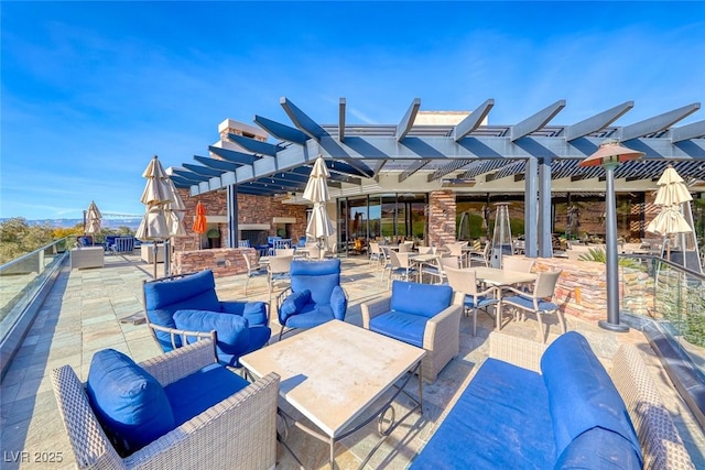 view of patio / terrace with an outdoor living space and a pergola