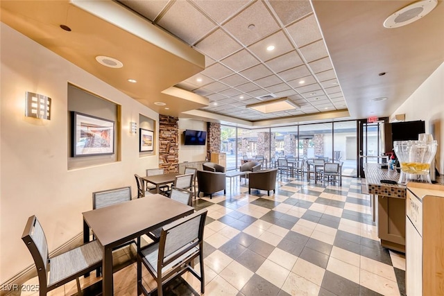 dining space featuring recessed lighting, visible vents, and a raised ceiling