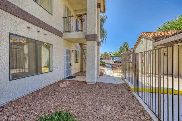 view of yard featuring a patio area and a balcony