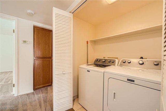 laundry area featuring light carpet, laundry area, and washing machine and dryer