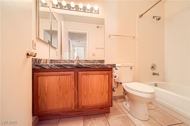bathroom with toilet, tile patterned floors, vanity, and bathtub / shower combination