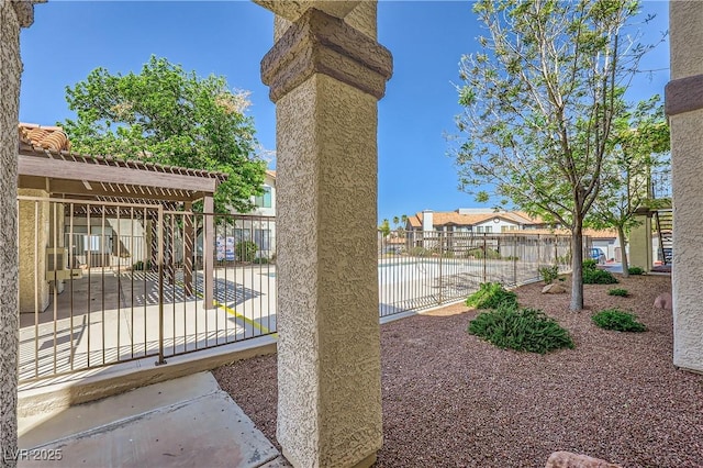 view of patio featuring fence