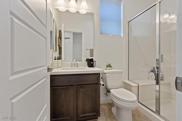 bathroom featuring toilet, vanity, and a stall shower
