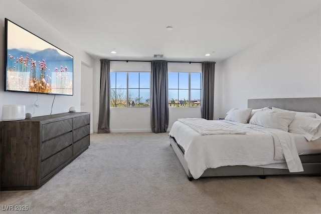 bedroom featuring light carpet, visible vents, and recessed lighting
