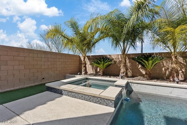 view of swimming pool with an in ground hot tub and a fenced backyard