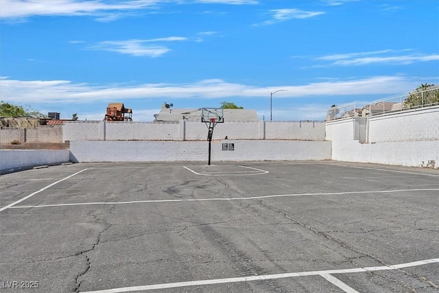 6800 E Lake Mead Blvd Unit 2050, Las Vegas, NV 89156 - uncovered parking lot featuring community basketball court and fence