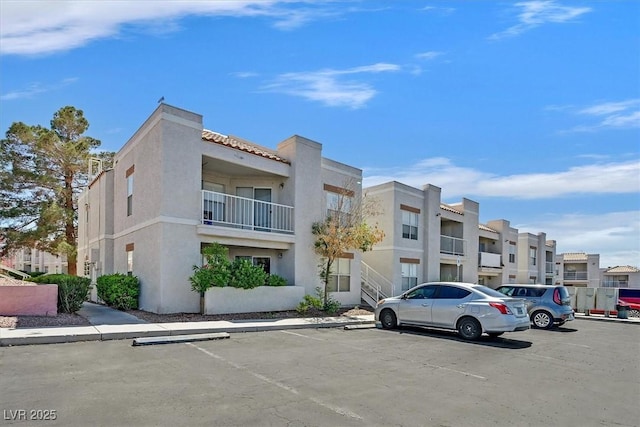 6800 E Lake Mead Blvd Unit 2050, Las Vegas, NV 89156 - view of property featuring uncovered parking and a residential view
