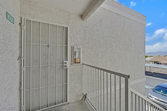 6800 E Lake Mead Blvd Unit 2050, Las Vegas, NV 89156 - view of exterior entry featuring stucco siding and a balcony