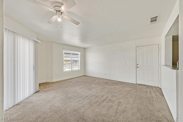 6800 E Lake Mead Blvd Unit 2050, Las Vegas, NV 89156 - empty room with light carpet, ceiling fan, and baseboards