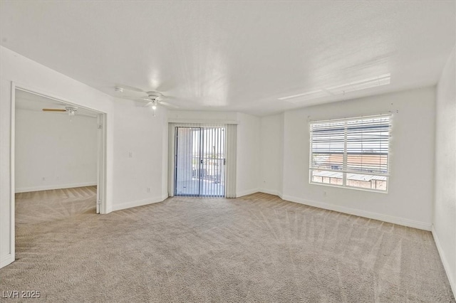 6800 E Lake Mead Blvd Unit 2050, Las Vegas, NV 89156 - carpeted empty room featuring baseboards and a ceiling fan