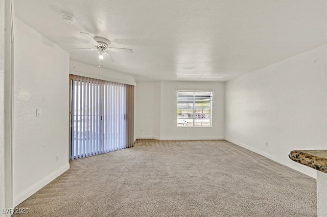 6800 E Lake Mead Blvd Unit 2050, Las Vegas, NV 89156 - empty room featuring light colored carpet, baseboards, ceiling fan, and a smoke detector