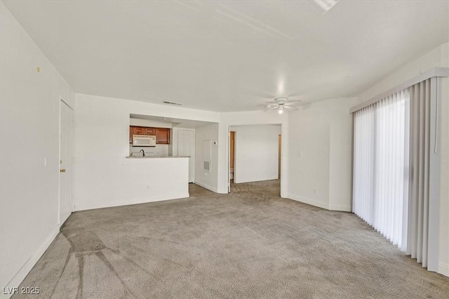 6800 E Lake Mead Blvd Unit 2050, Las Vegas, NV 89156 - unfurnished living room with carpet flooring, ceiling fan, and baseboards