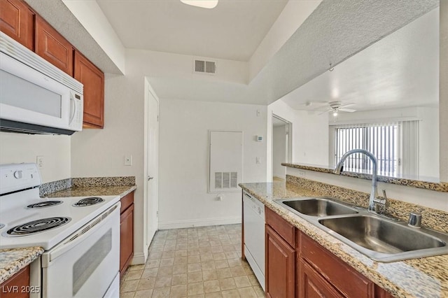 6800 E Lake Mead Blvd Unit 2050, Las Vegas, NV 89156 - kitchen featuring white appliances, a sink, light countertops, baseboards, and a ceiling fan