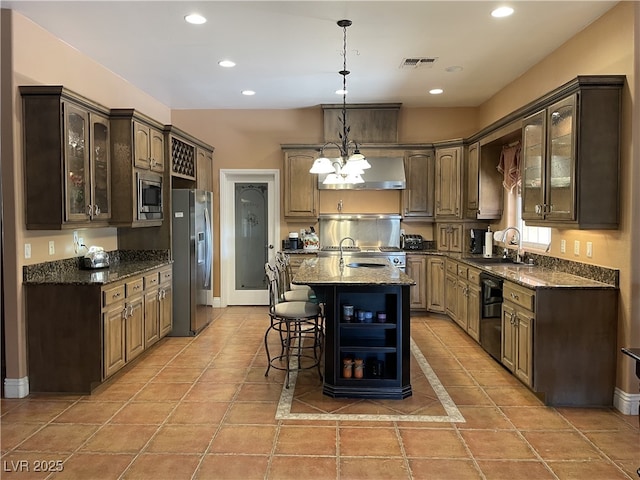 210 Lailani St, Las Vegas, NV 89110 - kitchen with glass insert cabinets, open shelves, a sink, wall chimney range hood, and stainless steel appliances