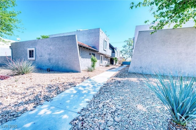 view of home's exterior with stucco siding