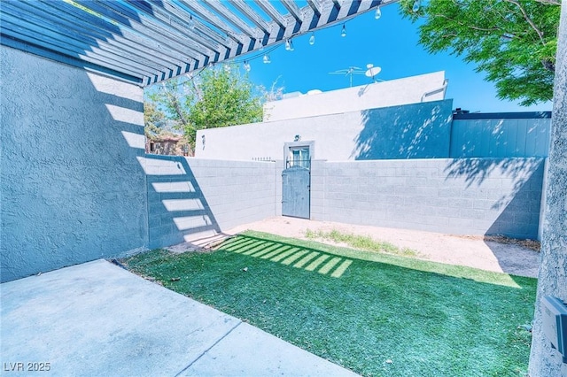 exterior space featuring a fenced backyard and a pergola