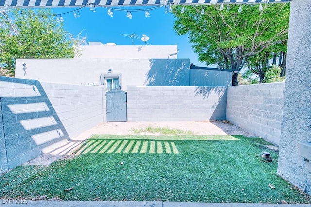 view of yard featuring fence private yard and a gate
